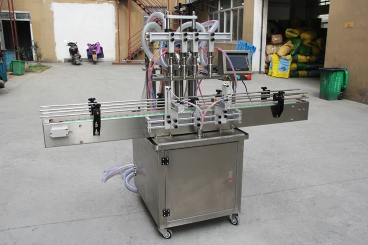 Nouveau design semi-automatique huile / jus / eau / miel liquide boîte en verre en plastique bouteille remplissage emballage machine