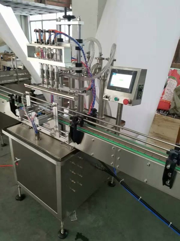 Machine de remplissage en ligne 4 buses Machine de remplissage de liquide débordement automatique Filler de bouteille liquide pour jus de boisson
